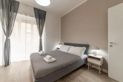a bedroom with a bed with two towels on it at Domus 124, elegant city Comfort with Parking in Rome