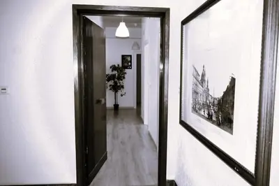 a hallway with a mirror and a picture on the wall at Fem House in Rome