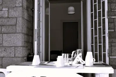 a bathroom with a mirror and a white sink at Fem House in Rome