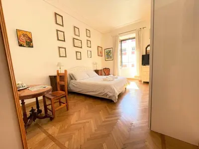 a bathroom with two sinks and a toilet and a mirror at Camera matrimoniale Roma Centro Vaticano in Rome