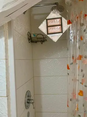 a bathroom with a shower and a light at G&A Rome House in Rome