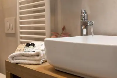a bathroom sink with a faucet on a counter at iFlat Radiant retreat in Esquilino in Rome