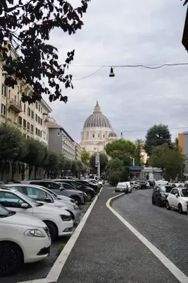 a bunch of cars parked in a parking lot at Domus St Peter in Rome
