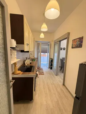a kitchen with a sink and a stove at La Casa di Aimara in Rome