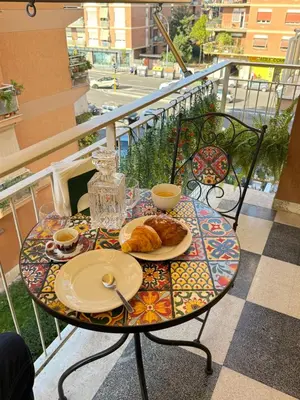 a living room with a couch and a table at La Casa di Aimara in Rome