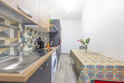 a small kitchen with a sink and a counter at Amora Apartments in Rome