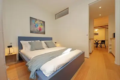 a bedroom with a large bed in a room at Modern Family Apartment in Rome