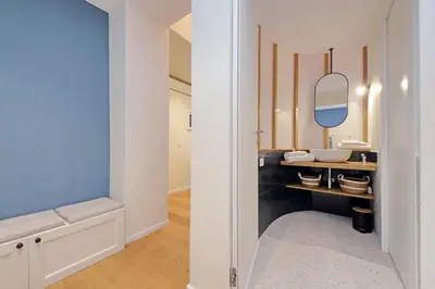 a bathroom with a sink and a mirror at Modern Family Apartment in Rome