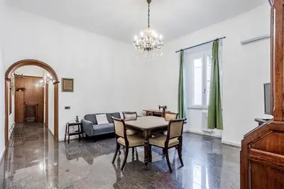 a living room with a table and a couch at La Casa Viola in Rome