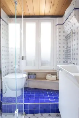 a bathroom with a shower and a toilet and a sink at Trastevere Cottage in Rome