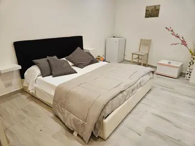 a bedroom with a large bed in a room at Roma Sweet Dreams casa vacanze in Rome