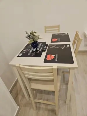 a white table with two menus on top of it at Roma Sweet Dreams casa vacanze in Rome