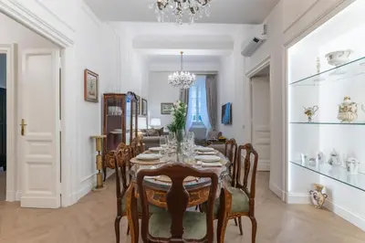 a dining room with a table and chairs at Vista su Campo de Fiori in Rome