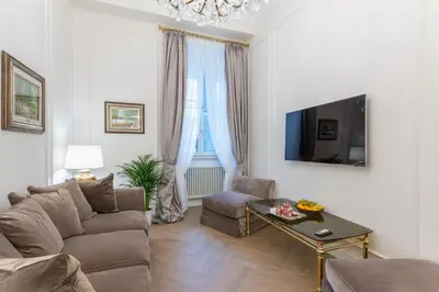 a living room with a couch and a table at Vista su Campo de Fiori in Rome