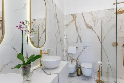 a bathroom with a sink and two toilets at Vista su Campo de Fiori in Rome