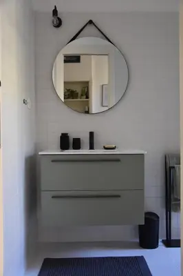 a bathroom with a sink and a mirror on the wall at RoMa Apt In Vatican in Rome