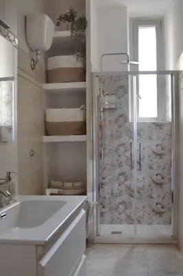 a bathroom with a shower and a tub and a sink at RoMa Apt In Vatican in Rome