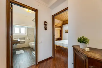 a bathroom with a sink and a toilet in a room at Elegante appartamento 130mq in stile classico in Rome