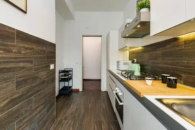 a kitchen with a sink and a counter top at Elegante appartamento 130mq in stile classico in Rome