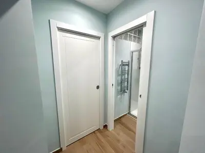 an empty room with two doors and a hallway at The Rooms of Wonders in Rome