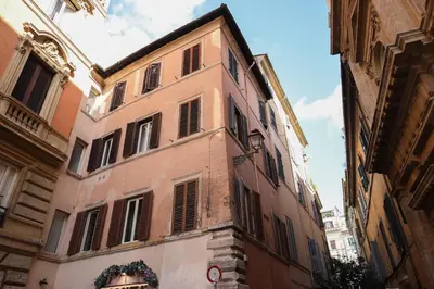 an old building in an alley in a city at Domus Minelli Navona by GHOR in Rome