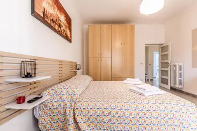 a bedroom with a large bed in a room at Galaxia Home in Rome