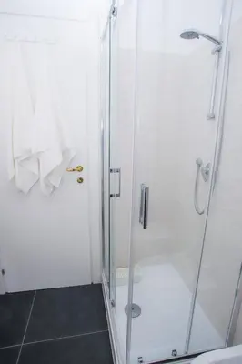 a shower with a glass door in a bathroom at Oasi urbana - The Vatican Roof Garden in Rome