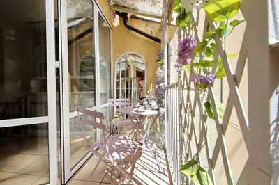 a patio with a table and chairs on a balcony at Luxury Navona apartments by Flatinrome in Rome