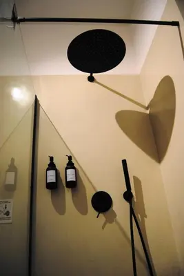 a room with two bottles of soap on a wall at Alloggio Appio Claudio con Corte Esclusiva I Metro A in Rome