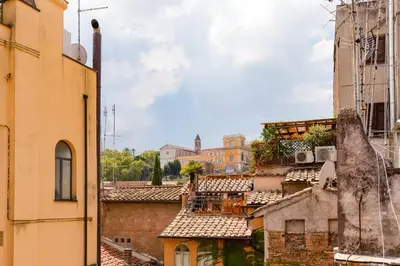 a view of roofs of buildings in a city at Romantic house with terrace in Rome