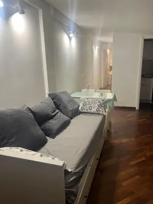 a large bed in a room with a table at Notte tra le stelle in Rome