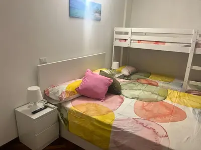 a bedroom with two bunk beds and a desk at Notte tra le stelle in Rome