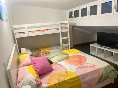 a small bedroom with a bunk bed and a bunk bed at Notte tra le stelle in Rome