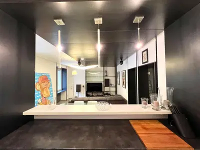 a living room with a large white table in a room at Apuania 12 in Rome