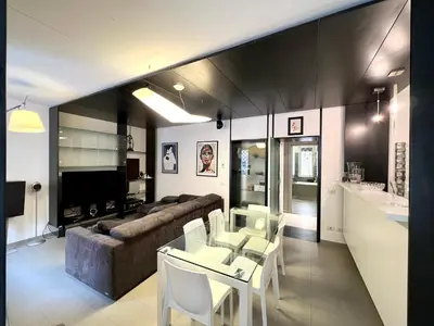 a living room with a couch and a table and chairs at Apuania 12 in Rome