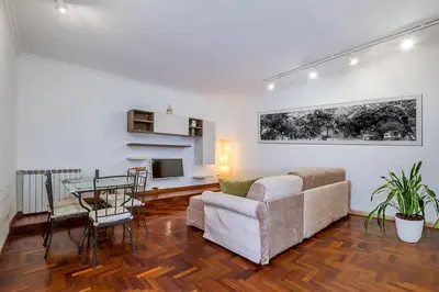 a living room with a couch and a table at ht m&n bilo colosseo in Rome
