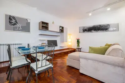 a living room with a couch and a table at ht m&n bilo colosseo in Rome