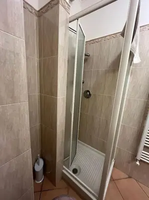 a shower with a glass door in a bathroom at La Dolce Vita - Casa Mì in Rome