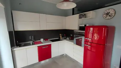 a kitchen with a red refrigerator and a sink at Nuova Casa Elena a Montesacro in Rome