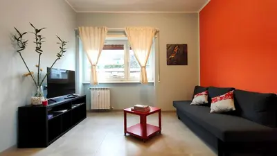 a living room with a couch and a table at Nuova Casa Elena a Montesacro in Rome