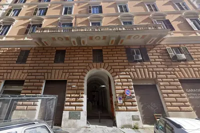 a brick building with a balcony on top of it at NEW Mini Loft per 3 a Roma centro in Rome