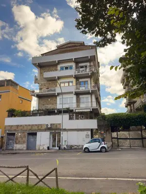 a building with a car parked in front of it at Una Terrazza su San Pietro in Rome