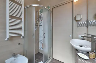 a bathroom with a shower and a sink at A casa di Roberta in Rome