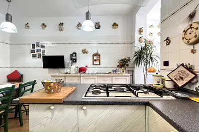 a kitchen with a stove and a counter top at Penthouse with terrace - Vatican Museums, Saint Peter's in Rome