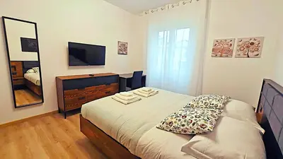 a small bedroom with a bed and a television at RomeBestHome Scialoja - Piazza del Popolo in Rome