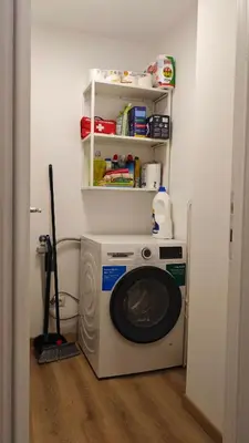 a washer and dryer in a corner of a room at RomeBestHome Scialoja - Piazza del Popolo in Rome