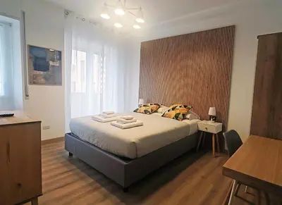 a bedroom with a bed with two towels on it at RomeBestHome Scialoja - Piazza del Popolo in Rome