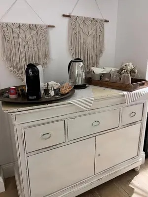a white dresser in a room with a counter top at La Maison du Charme in Rome
