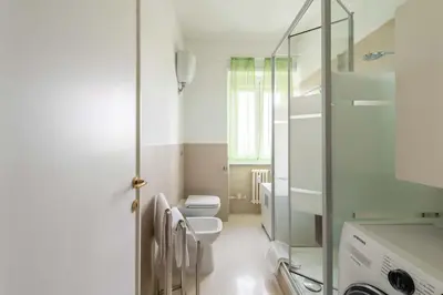a bathroom with a toilet and a glass shower at 7h Heaven RHome Vatican Museums in Rome