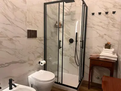 a bathroom with a shower and a toilet at Romance al Colosseo 3 in Rome